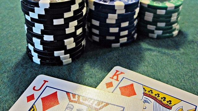 Stacks of casino chips and playing cards