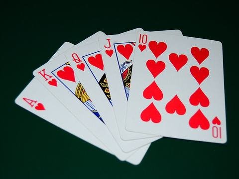 Royal flush poker hand in hearts